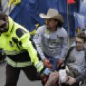 Medical responders run an injured man past the finish line the 2013 Boston Marathon following an explosion in Boston, Monday, April 15, 2013. Two explosions shattered the euphoria of the Boston Marathon finish line on Monday, sending authorities out on the course to carry off the injured while the stragglers were rerouted away from the smoking site of the blasts. (AP Photo/Charles Krupa)