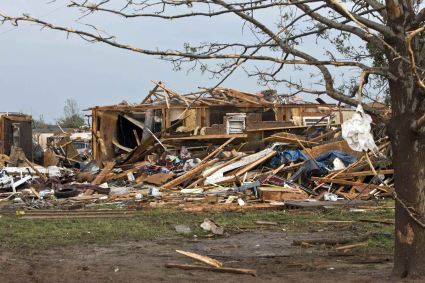 A destroyed house remains after a huge tornado struck Moore, Oklahoma, near Oklahoma City, May 20, 2013. A massive tornado tore through the Oklahoma City suburb of Moore on Monday, killing at least 51 people as winds of up to 200 miles per hour (320 kph) flattened entire tracts of homes, two schools and a hospital, leaving a wake of tangled wreckage. REUTERS/Richard Rowe (UNITED STATES - Tags: DISASTER ENVIRONMENT)